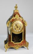 LATE NINETEENTH CENTURY FRENCH RED SHELL AND ORMOLU BOULLE WORK MANTLE CLOCK, the 4” twelve piece
