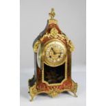 LATE NINETEENTH CENTURY FRENCH RED SHELL AND ORMOLU BOULLE WORK MANTLE CLOCK, the 4” twelve piece