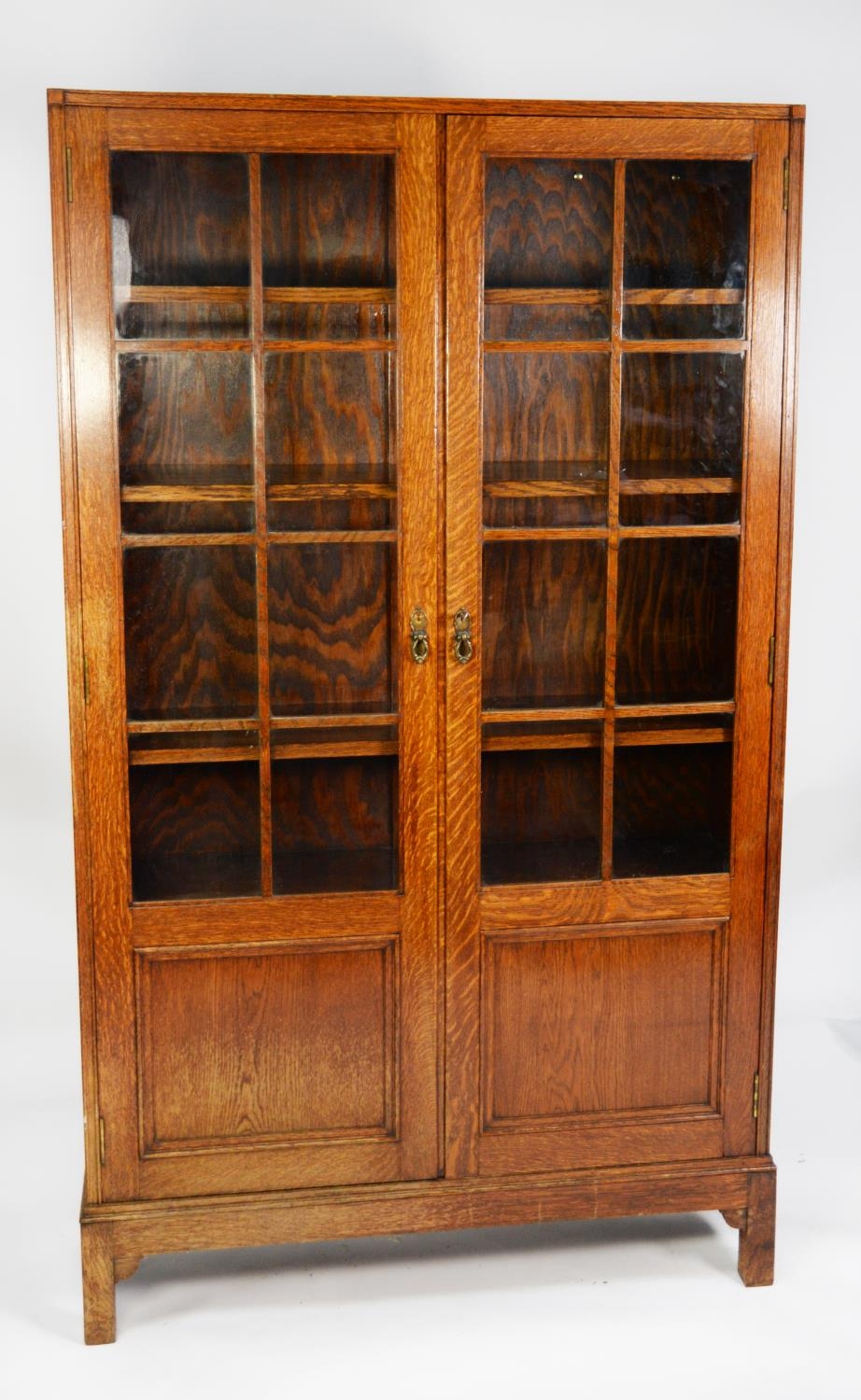 GLOBE WERNICKE OAK BOOKCASE, each of the pair of cupboard doors with eight astragal glazed square