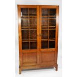 GLOBE WERNICKE OAK BOOKCASE, each of the pair of cupboard doors with eight astragal glazed square