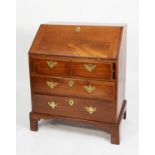 GEORGE III MAHOGANY BUREAU, the interior fitted with short drawers and pigeon holes, around a
