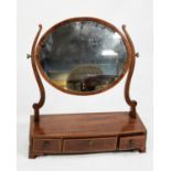 GEORGE III LINE INLAID MAHOGANY TOILET MIRROR, the oval plate in a crossbanded frame, flanked by