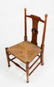 NINETEENTH CENTURY CHILD’S INLAID OAK AND RUSH SEATED CHAI, with turned uprights and pictorial inlay