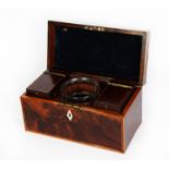 GEORGE III FLAME CUT MAHOGANY AND LINE INLAID TEA CADDY, of oblong form with brass loop handle to