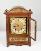 EARLY TWENTIETH CENTURY BRASS MOUNTED OAK MANTEL CLOCK, the 7” brass dial with silvered chapter