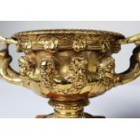 PAIR OF ORMOLU TWO HANDLED WARWICK STYLE SMALL URN PATTERN RECEIVERS, each with removable liner, and