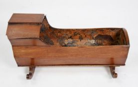 VICTORIAN MAHOGANY DOLL’S CRADLE, with canopy top and chamfered sides, floral paper lined