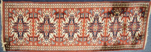 CAUCASUAN CHELABERD KARABAGH RUNNER with a row of six sunburst style medallions in red, dark blue