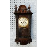 EARLY TWENTIETH CENTURY DARK STAINED PINE CASED VIENNA STYLE SMALL WALL CLOCK, with 4 ½” silvered