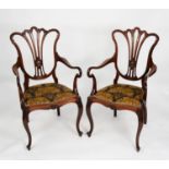 PAIR OF EDWARDIAN CARVED MAHOGANY CARVER TYPE OPEN ARMCHAIRS FROM A DRAWING ROOM SUITE, each with