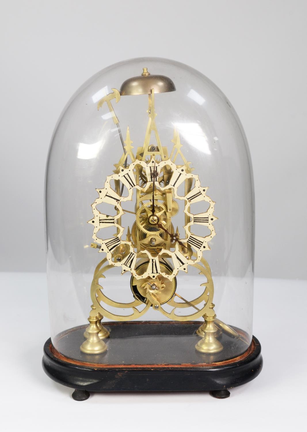 NINETEENTH CENTURY BRASS SKELETON CLOCK, the 6 ¼” pierced and enamelled Roman chapter ring powered