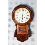 LATE NINETEENTH CENTURY CARVED WALNUT DROP DIAL WALL CLOCK, with 12” enamelled Roman dial and the