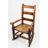 NINETEENTH CENTURY CHILD’S ELM AND FRUITWOOD LADDER BACK ROCKING CHAIR, of typical form with