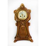 EARLY TWENTIETH CENTURY ART NOUVEAU GILT SPELTER MANTLE CLOCK, the 3 ¼” enamelled Arabic dial with