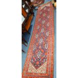 PAIR OF SHIRAZ, PERSIAN RUNNERS each with six section pole, on dark blue field, white spandrels,