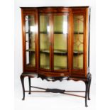 EDWARDIAN LINE INLAID MAHOGANY DISPLAY CABINET, the shaped top above a ribbon ted swag inlaid