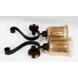 PAIR OF MODERN OF BLACK METAL AND CRACKLE GLASS WALL MOUNTED CANDLE HOLDERS, each with scroll