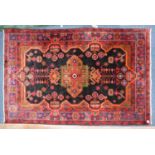 HAMADAN, PERSIAN RUG with angular quatrefoil centre medallion, with pendants on a black field with