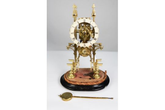 LATE NINETEENTH CENTURY BRASS SKELETON CLOCK, the 5” enamelled Roman chapter ring powered by a - Image 1 of 2