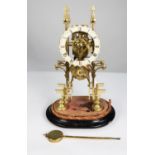 LATE NINETEENTH CENTURY BRASS SKELETON CLOCK, the 5” enamelled Roman chapter ring powered by a