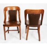 SET OF FIVE EARLY TWENTIETH CENTURY HEAVY OAK LIBRARY OR BOARDROOM CHAIRS, each with central pad,