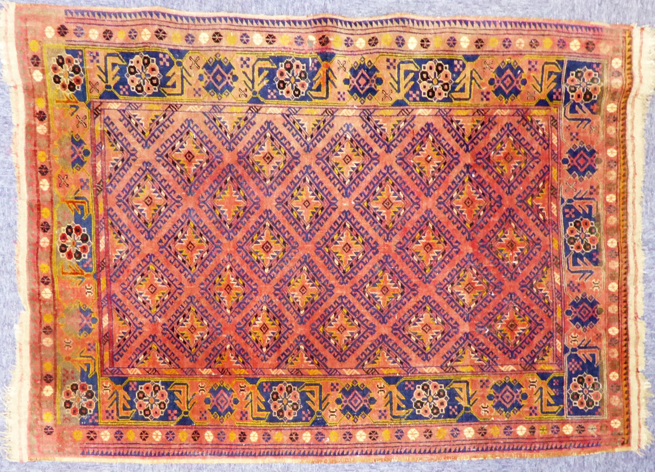 SEMI ANTIQUE SHIRAZ PERSIAN RUG, with all-over Caucasian style diamond in dark blue on a wine red