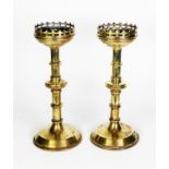 PAIR OF NINETEENTH CENTURY GOTHIC REVIVAL BRASS ALTAR STICKS, each with pierced border and knopped