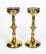 PAIR OF NINETEENTH CENTURY GOTHIC REVIVAL BRASS ALTAR STICKS, each with pierced border and knopped