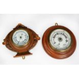 TWO EARLY TWENTIETH CENTURY OAK CASED ANEROID BAROMETERS, one in circular, moulded case, 10 ¾” (27.