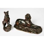 TWO PATINATED BRONZE MODELS OF DOGS, one as a RECLINING LURCHER, 3 ½” (8.9cm) high, 6 ¼” (15.9cm)