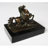 PATINATED BRONZE GROUP OF A REARING HORSE BEING ATTACKED BY A LARGE SNAKE, on an oblong base, and
