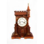 VICTORIAN CASTELLATED OAK CASED MANTLE CLOCK, the 5 ½” two part enamelled Roman dial powered by a