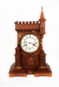 VICTORIAN CASTELLATED OAK CASED MANTLE CLOCK, the 5 ½” two part enamelled Roman dial powered by a