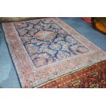 KASHAN, PERSIAN CARPET with circular centre medallion with pendants, on a dark blue field with all-