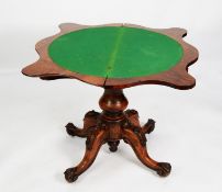 VICTORIAN FIGURED AND CARVED WALNUT PEDESTAL CARD TABLE, the fold-over top of serpentine outline