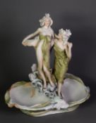 EARLY TWENTIETH CENTURY ROYAL DUX (BOHEMIA) PORCELAIN FIGURAL SHALLOW WATER RECEIVING BOWL in the
