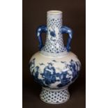 MODERN ORIENTAL BLUE AND WHITE TWO HANDLED PORCELAIN VASE, of footed form with elephant mask pattern