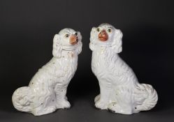 PAIR OF NINETEENTH CENTURY STAFFORDSHIRE POTTERY MANTLE DOG, each typical modelled and with burnt