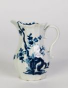 EIGHTEENTH CENTURY PORCELAIN CREAM JUG of panelled baluster form, painted in underglaze blue with