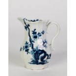 EIGHTEENTH CENTURY PORCELAIN CREAM JUG of panelled baluster form, painted in underglaze blue with