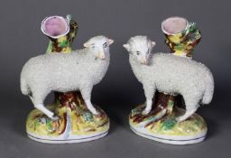 PAIR OF REPRODUCTION STAFFORDSHIRE POTTERY SPILL VASES, each painted in colours and modelled with