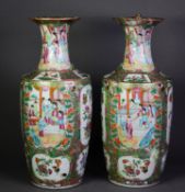 PAIR OF CHINESE LATE QING DYNASTY CANTON DECORATED VASES, the oviform bodies beneath waisted