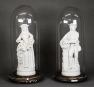 PAIR OF LATE NINETEENTH/ EARLY TWENTIETH CENTURY PARIAN PORCELAIN FIGURES, she modelled holding a