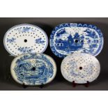 FOUR EIGHTEENTH CENTURY AND LATER BLUE AND WHITE POTTERY DRAINERS, each of typical form, three