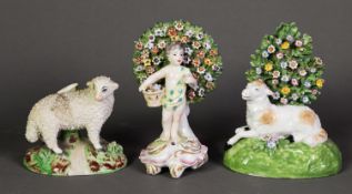 TWO EIGHTEENTH CENTURY STYLE BOCAGE PORCELAIN FIGURES, one modelled as a standing putto with a