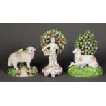 TWO EIGHTEENTH CENTURY STYLE BOCAGE PORCELAIN FIGURES, one modelled as a standing putto with a