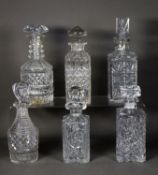 TWO CUT GLASS SPIRIT DECANTERS AND STOPPERS, TWO SIMILAR MOULDED AND CUT GLASS DECANTERS AND