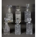 TWO CUT GLASS SPIRIT DECANTERS AND STOPPERS, TWO SIMILAR MOULDED AND CUT GLASS DECANTERS AND