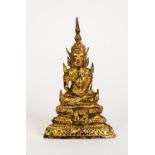 AGED FAR EASTERN CAST METAL AND GILDED FIGURE OF A SEATED BUDDHA, 6 ¼” (15.9cm) high, unmarked