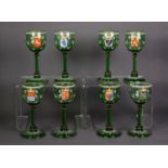 SET OF EIGHT GERMAN ENAMELLED AND CRESTED GREEN GLASS TALL STEMMED GLASSES, each with spiral